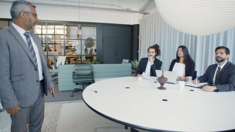 Business meeting in modern office, discussing AI decision intelligence by Suprmind.