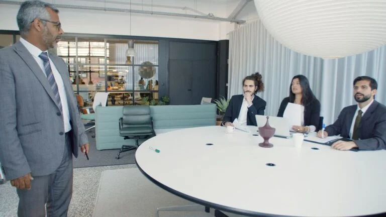 Business meeting in modern office, discussing AI decision intelligence by Suprmind.