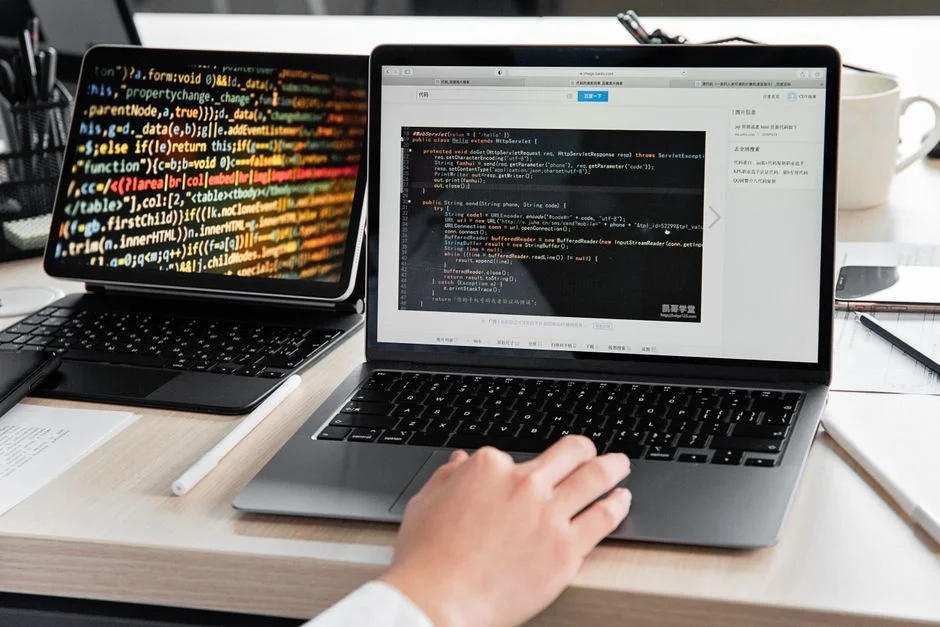 Multi AI orchestrator interface on laptops in a modern workspace.