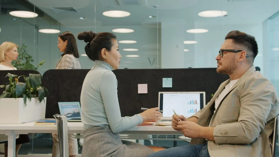 Modern workspace with professionals discussing AI decision intelligence at Suprmind.